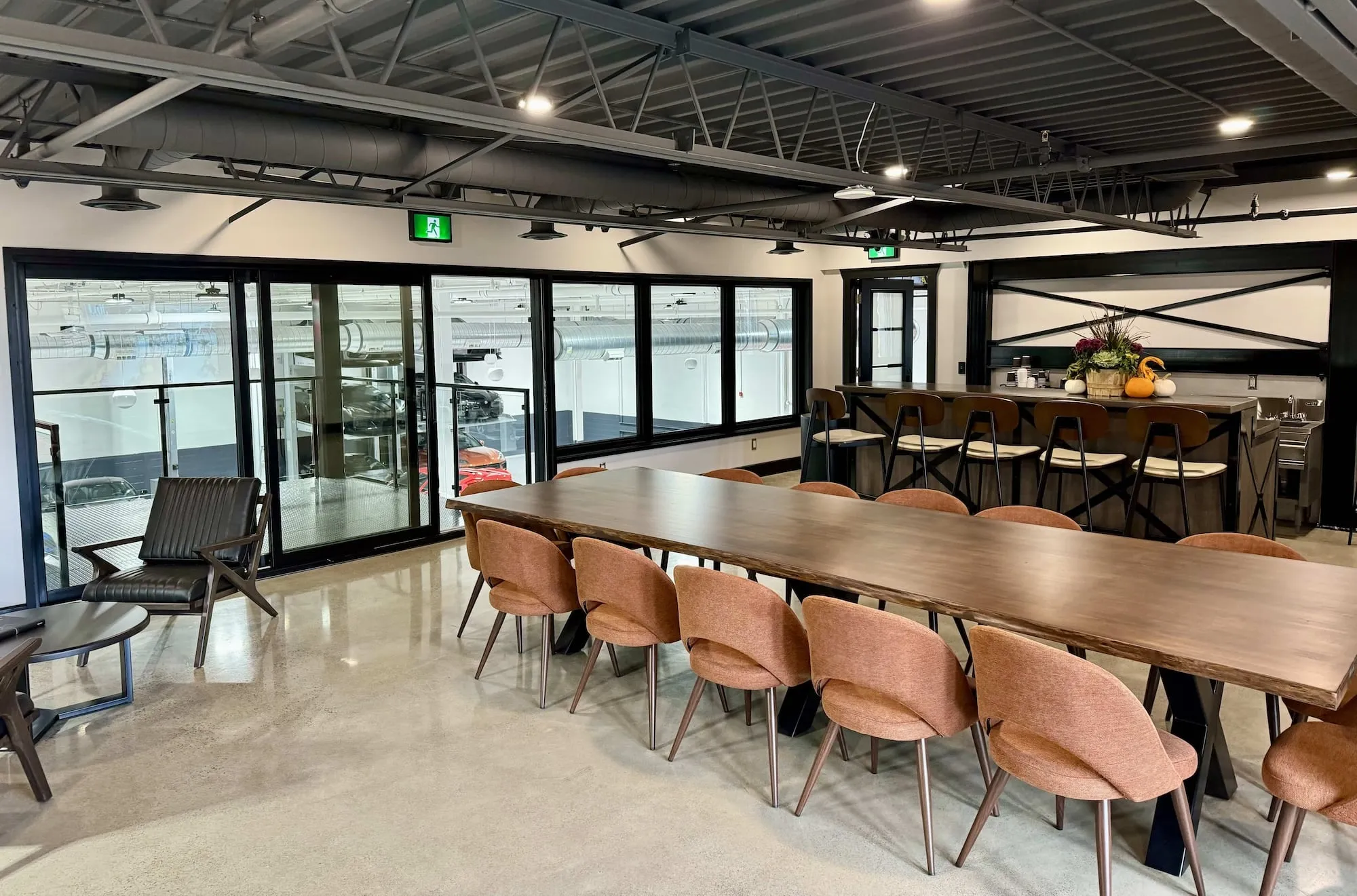 A modern boardroom with a long table and chairs
