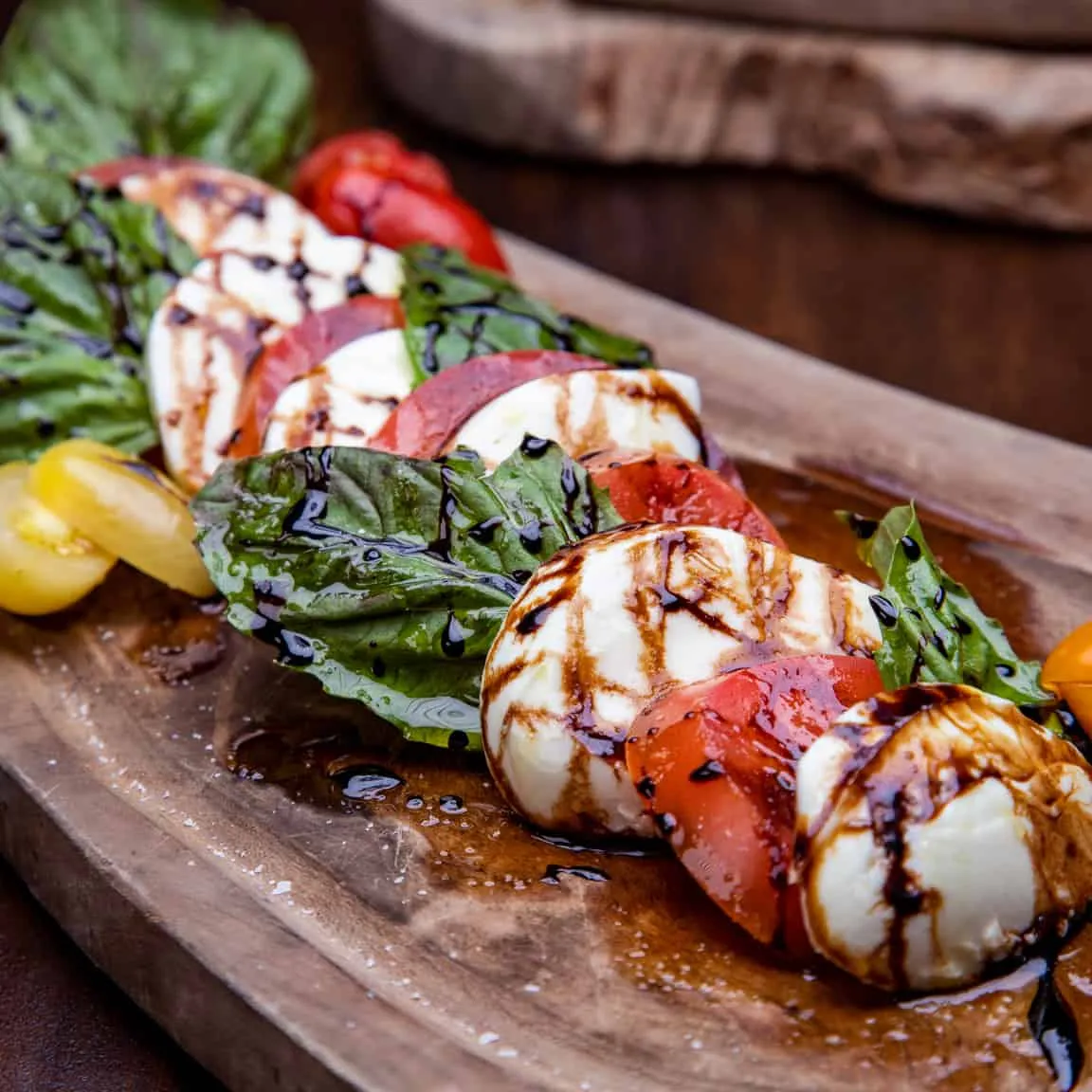 A scrumptious charcuterie board with a variety of cheeses, and accompaniments