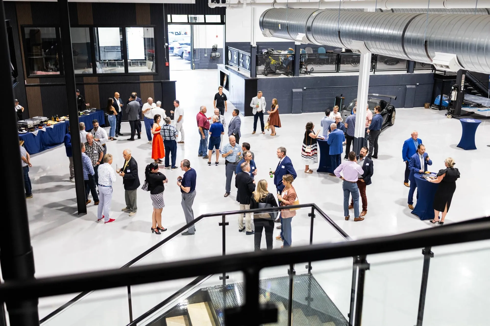 A group of people standing in a large room