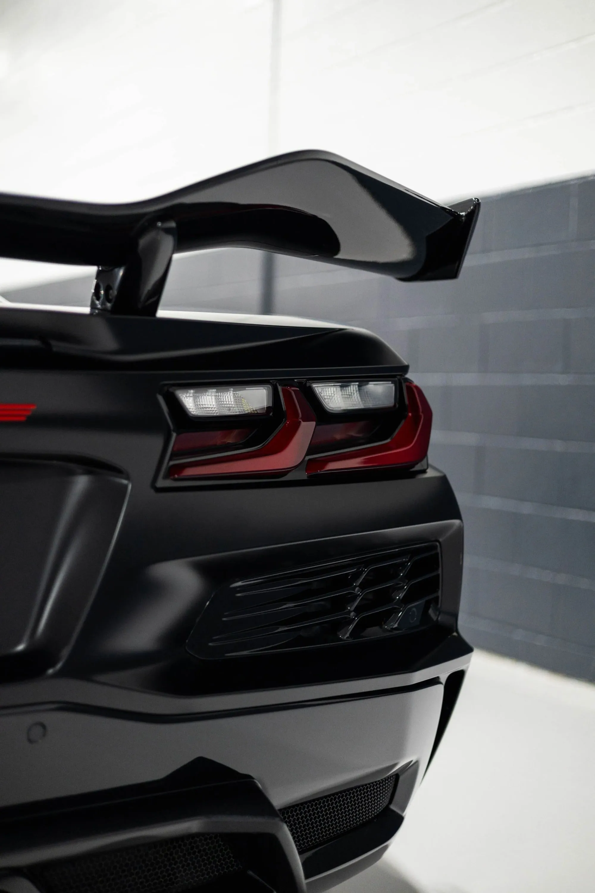The rear end of a black sports car
