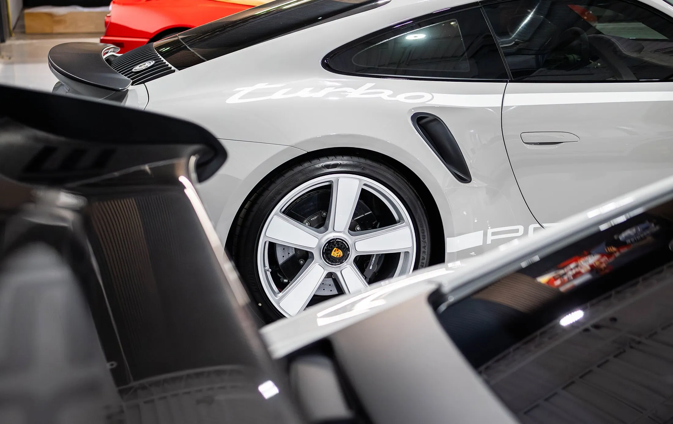 Sports cars on display in a showroom